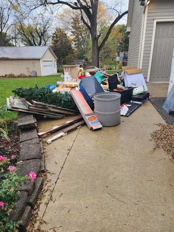 Dumpster being loaded with debris for Estate Cleanout Dumpster Rental in Guadalupe